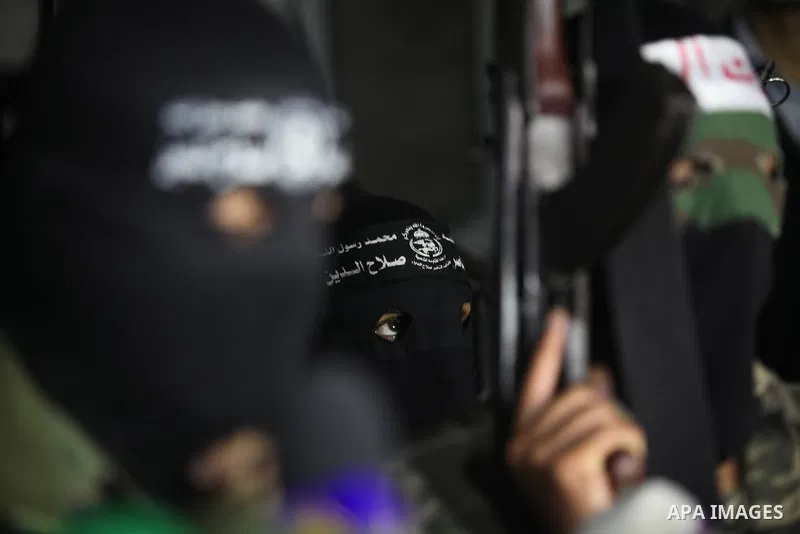 Palestinian masked gunmen, belonging to the Popular Resistance Committees (PRC), attend a press conference in Gaza City on November 11, 2012. The outbreak of violence was one of the most serious since Israel's devastatin...
