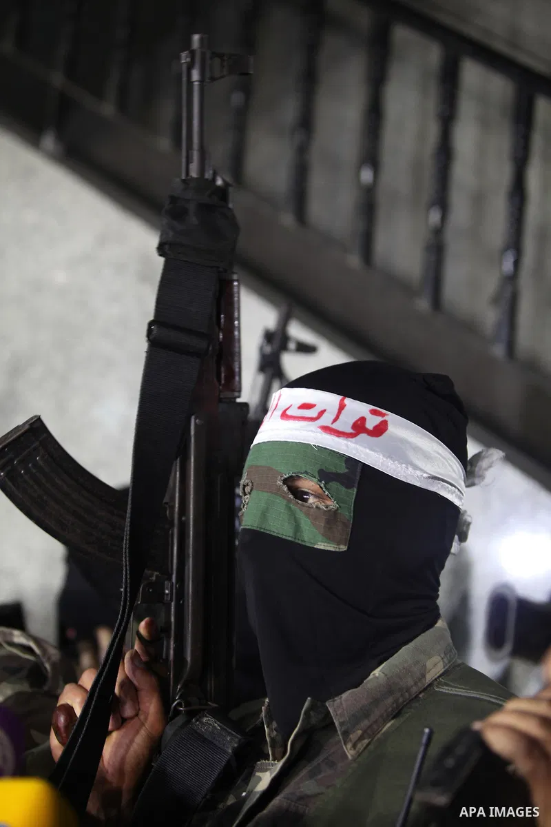 Palestinian masked gunmen, belonging to the Popular Resistance Committees (PRC), attend a press conference in Gaza City on November 11, 2012. The outbreak of violence was one of the most serious since Israel's devastatin...