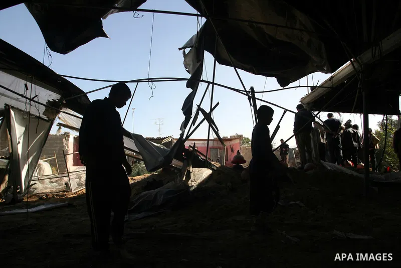 Palestinians inspect the damage to their home following an Israeli military air strike in Rafah town in the southern Gaza Strip, on November 11, 2012. The flare-up which began November 10, was one of the most serious sin...