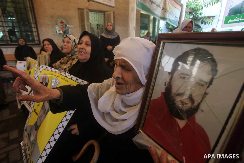 Palestinians woman participate a protest in front of the International Red Cross building in Gaza City, to calling for the release from Palestinian prisoners in Israeli jails and in support of prisoners on hunger strike,...