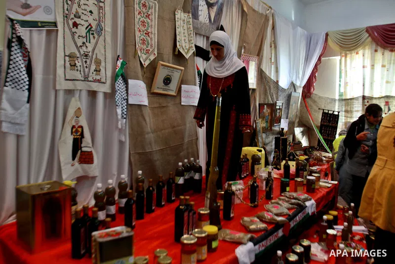 Palestinians woman participate in the opening of the Olive Festival in the in the West Bank of Salfit, on Nov. 11, 2012. Photo by Nedal Eshtayah