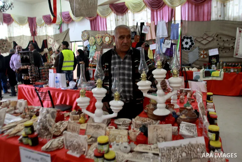 Palestinians man participate in the opening of the Olive Festival in the in the West Bank of Salfit, on Nov. 11, 2012. Photo by Nedal Eshtayah