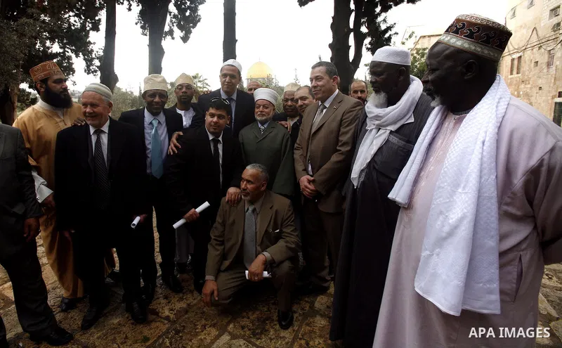 French writer Marek Halter (not seen) and a delegation of imams from France stand outside the Dome of the Rock during a visit to the Al-Aqsa mosque compound, Islam's third holiest, in the old city of Jerusalem on Novembe...