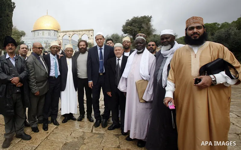 French writer Marek Halter (Center left) and a delegation of imams from France stand outside the Dome of the Rock during a visit to the Al-Aqsa mosque compound, Islam's third holiest, in the old city of Jerusalem on Nove...