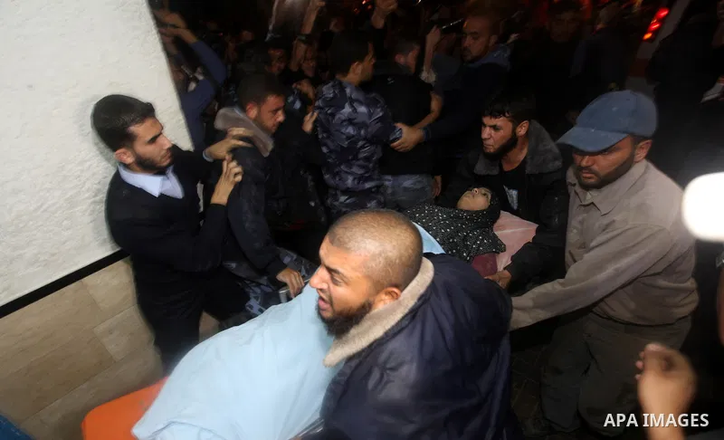 Palestinian medics wheel a wounded woman into the al-Shifa hospital in Gaza City following an Israeli air strike on November 14, 2012. An Israeli strike that killed Hamas's top commander in Gaza is only "the beginning" o...