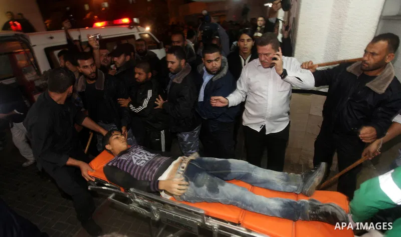 Palestinian medics wheel a wounded man into the al-Shifa hospital in Gaza City following an Israeli air strike on November 14, 2012. An Israeli strike that killed Hamas's top commander in Gaza is only "the beginning" of...