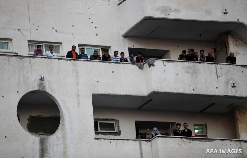 Palestinians gather into a hospital after an Israeli air strike in Gaza City November 14, 2012. Israel killed the military commander of the Islamist group Hamas in a missile strike on the Gaza Strip on Wednesday and laun...