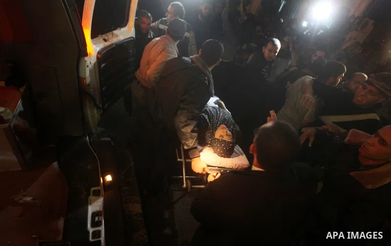 Palestinians wheel a wounded woman into a hospital after an Israeli air strike in Gaza City November 14, 2012. Israel killed the military commander of the Islamist group Hamas in a missile strike on the Gaza Strip on Wed...