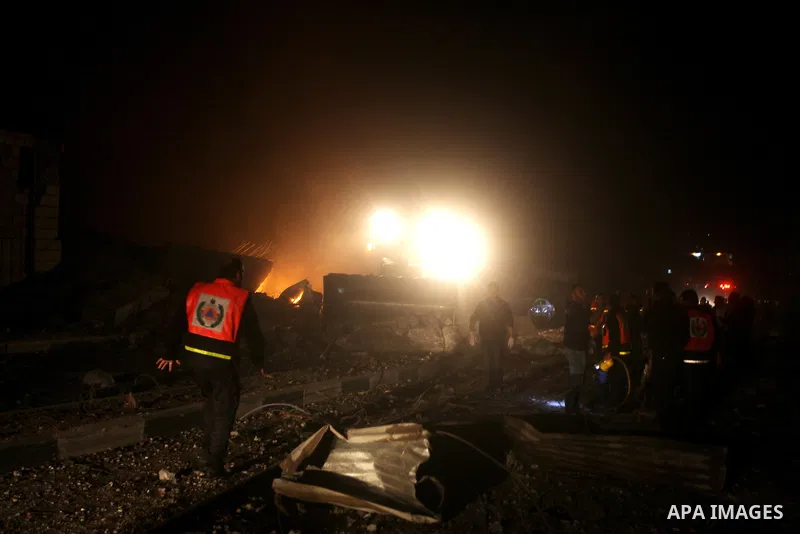 Palestinians try to extinguish fire following an Israeli air strike on November 14, 2012 in Gaza City. A top Hamas commander was among seven people killed in more than 20 Israeli air strikes on the Gaza Strip, as Israel...
