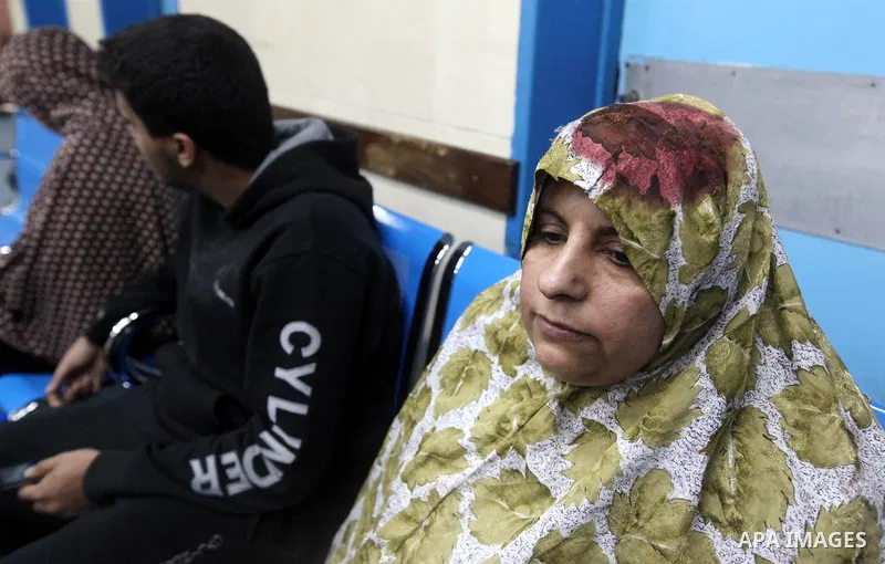 A Palestinian wounded woman waits at al-Shifa hospital following an Israeli airstrike in Gaza City, Wednesday, Nov. 14, 2012. The Israeli military said its assassination of the Hamas military commander Ahmed Jabari, mark...