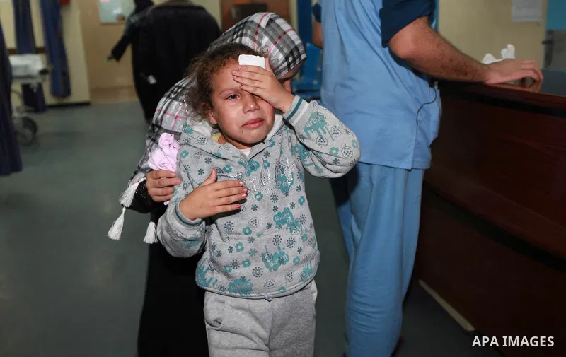 A Palestinian woman with her wounded daughter arrive to he treatment room of Shifa hospital following an Israeli airstrike in Gaza City, Wednesday, Nov. 14, 2012. The Israeli military said its assassination of the Hamas...