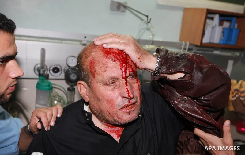 A Palestinian medic treats a wounded man into the treatment room of Shifa hospital following an Israeli airstrike in Gaza City, Wednesday, Nov. 14, 2012. The Israeli military said its assassination of the Hamas military...