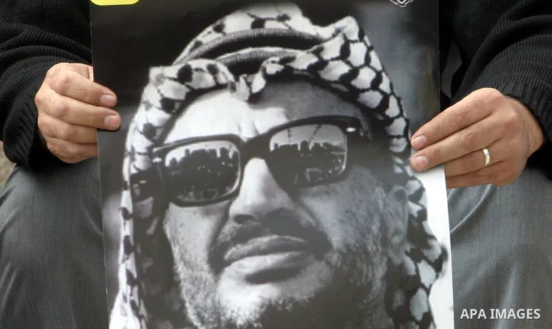 Palestinian protesters hold pictures of late Palestinian leader Yasser Arafat during a demonstration in support of the Palestinian statehood petition at the U.N. General Assembly near the Damascus gate in Jerusalem's Old...