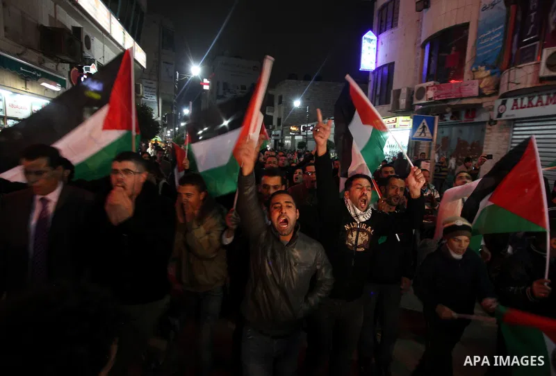 Palestenian protesters shout slogans as they march in the West Bank city of Ramallah on November 14, 2012 during a demonstration in support of the people of the Gaza Strip and against Israeli air strikes. Several Palesti...
