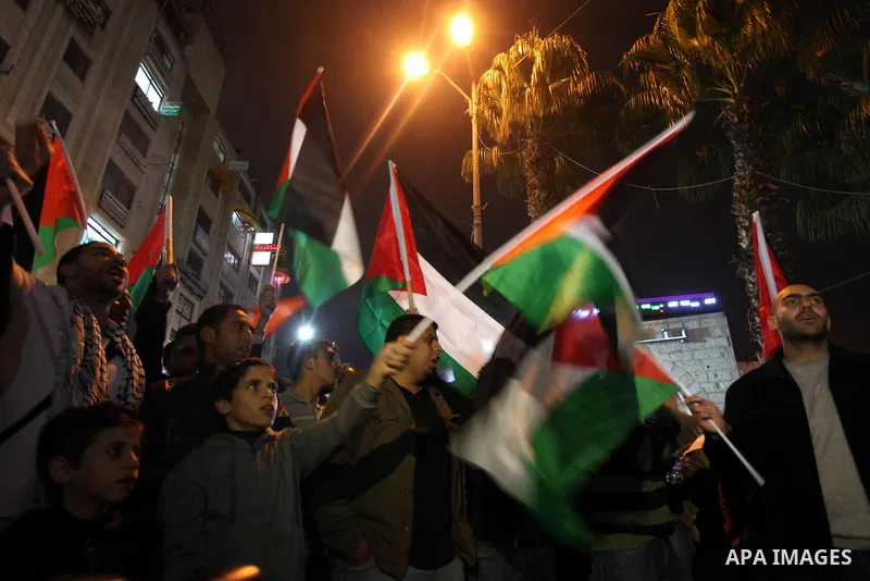 Palestenian protesters shout slogans as they march in the West Bank city of Ramallah on November 14, 2012 during a demonstration in support of the people of the Gaza Strip and against Israeli air strikes. Several Palesti...