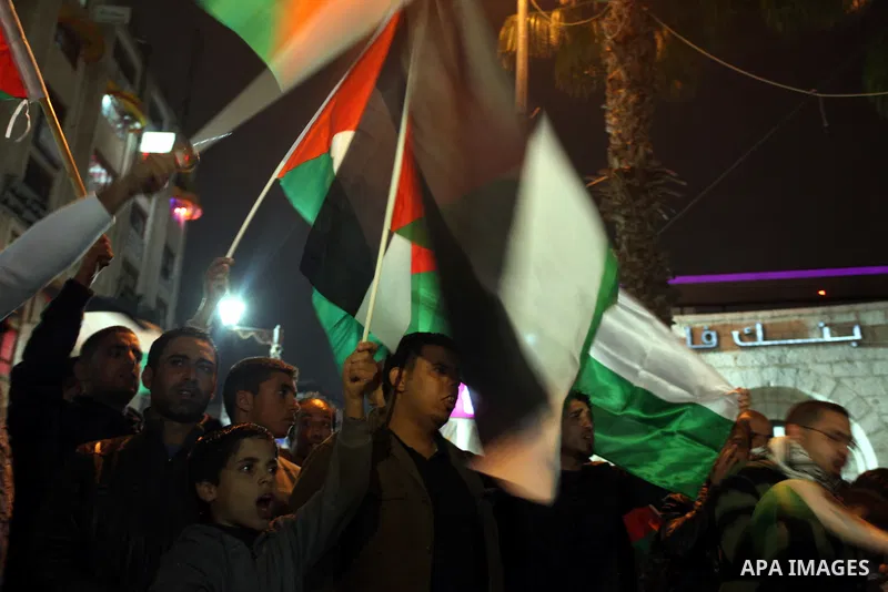 Palestenian protesters shout slogans as they march in the West Bank city of Ramallah on November 14, 2012 during a demonstration in support of the people of the Gaza Strip and against Israeli air strikes. Several Palesti...
