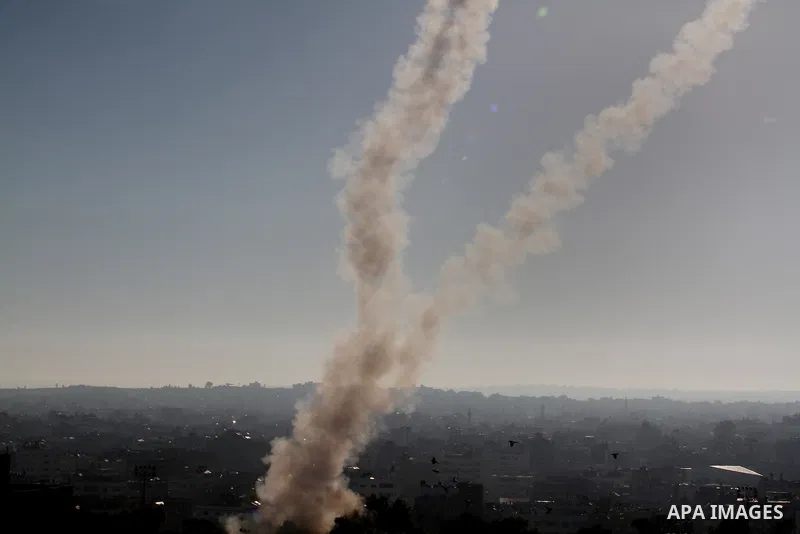 Rockets launched by Palestinian militants towards Israel make their way from the Gaza city, Thursday, Nov. 15, 2012. Photo by Momen Faiz