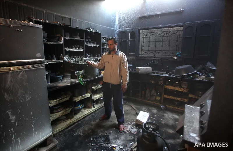 Palestinians check their damaged house after Israeli air strikes in Gaza City November 15, 2012. Israel exchanged the fiercest fire with Hamas in years after assassinating its military mastermind and threatening a wider...