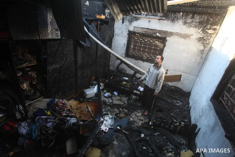 Palestinians check their damaged house after Israeli air strikes in Gaza City November 15, 2012. Israel exchanged the fiercest fire with Hamas in years after assassinating its military mastermind and threatening a wider...