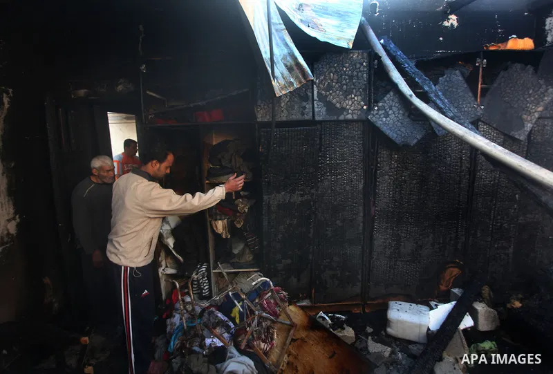 Palestinians check their damaged house after Israeli air strikes in Gaza City November 15, 2012. Israel exchanged the fiercest fire with Hamas in years after assassinating its military mastermind and threatening a wider...