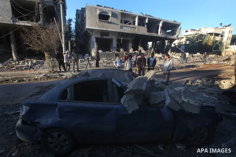 Palestinians check their damaged house after Israeli air strikes in Gaza City November 15, 2012. Israel exchanged the fiercest fire with Hamas in years after assassinating its military mastermind and threatening a wider...