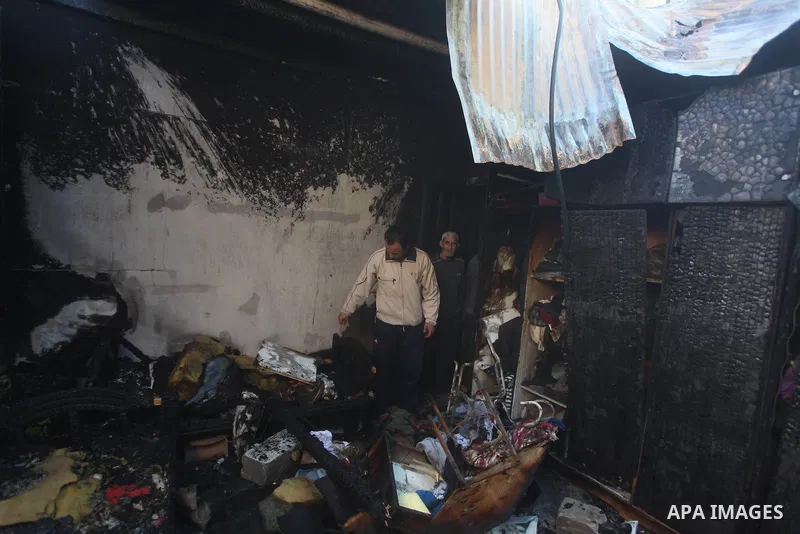 Palestinians check their damaged house after Israeli air strikes in Gaza City November 15, 2012. Israel exchanged the fiercest fire with Hamas in years after assassinating its military mastermind and threatening a wider...