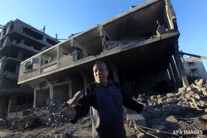 Palestinians check their damaged house after Israeli air strikes in Gaza City November 15, 2012. Israel exchanged the fiercest fire with Hamas in years after assassinating its military mastermind and threatening a wider...