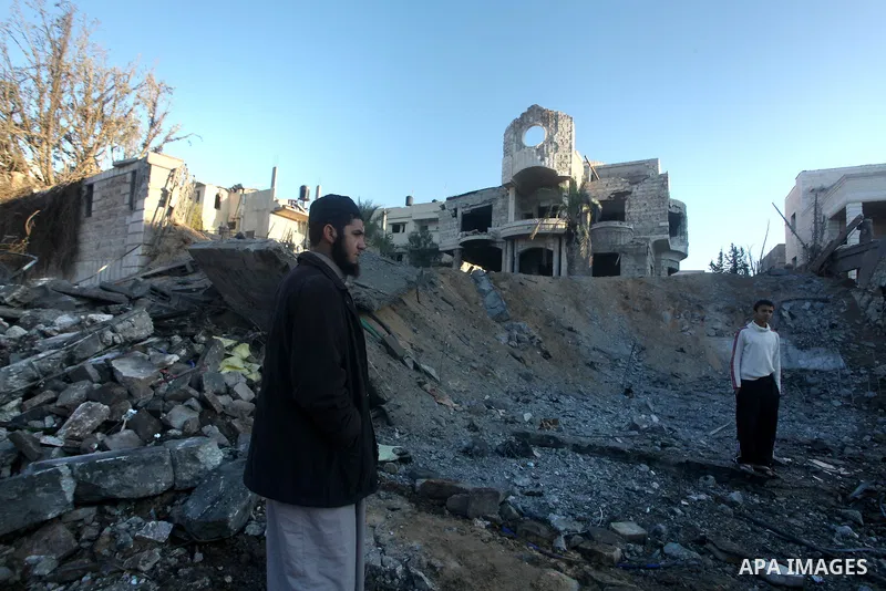 Palestinians check their damaged house after Israeli air strikes in Gaza City November 15, 2012. Israel exchanged the fiercest fire with Hamas in years after assassinating its military mastermind and threatening a wider...