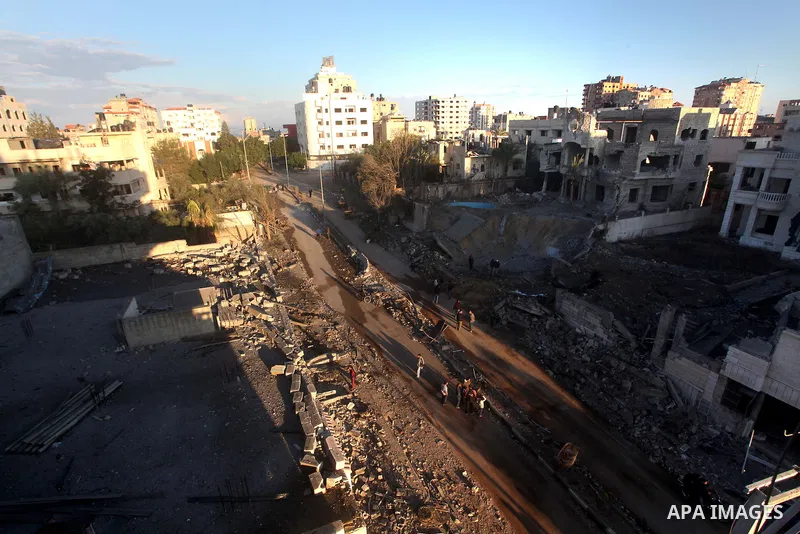 Palestinians check their damaged house after Israeli air strikes in Gaza City November 15, 2012. Israel exchanged the fiercest fire with Hamas in years after assassinating its military mastermind and threatening a wider...