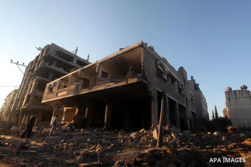 Palestinians check their damaged house after Israeli air strikes in Gaza City November 15, 2012. Israel exchanged the fiercest fire with Hamas in years after assassinating its military mastermind and threatening a wider...