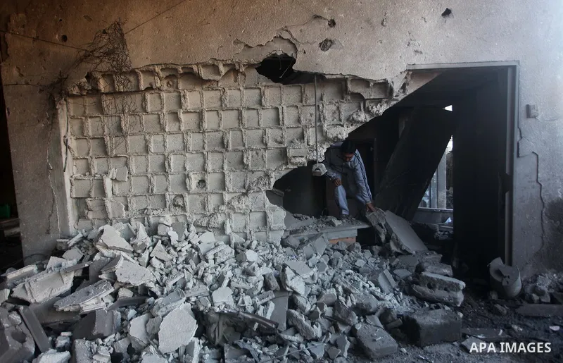Palestinians check their damaged house after Israeli air strikes in Gaza City November 15, 2012. Israel exchanged the fiercest fire with Hamas in years after assassinating its military mastermind and threatening a wider...