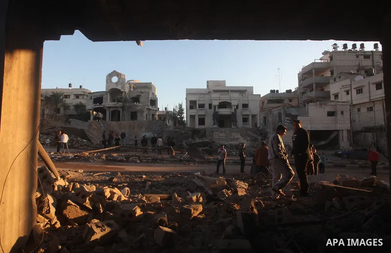 Palestinians check their damaged house after Israeli air strikes in Gaza City November 15, 2012. Israel exchanged the fiercest fire with Hamas in years after assassinating its military mastermind and threatening a wider...