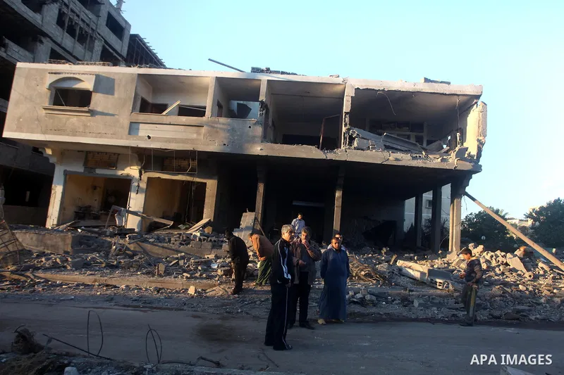 Palestinians check their damaged house after Israeli air strikes in Gaza City November 15, 2012. Israel exchanged the fiercest fire with Hamas in years after assassinating its military mastermind and threatening a wider...