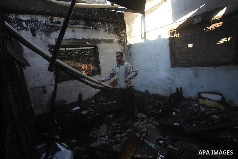 Palestinians check their damaged house after Israeli air strikes in Gaza City November 15, 2012. Israel exchanged the fiercest fire with Hamas in years after assassinating its military mastermind and threatening a wider...