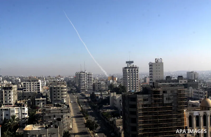 Rockets launched by Palestinian militants towards Israel make their way from the Gaza city, Thursday, Nov. 15, 2012. Photo by Naaman Omar