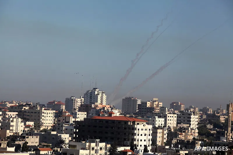 Rockets launched by Palestinian militants towards Israel make their way from the Gaza city, Thursday, Nov. 15, 2012. Photo by Ashraf Amra