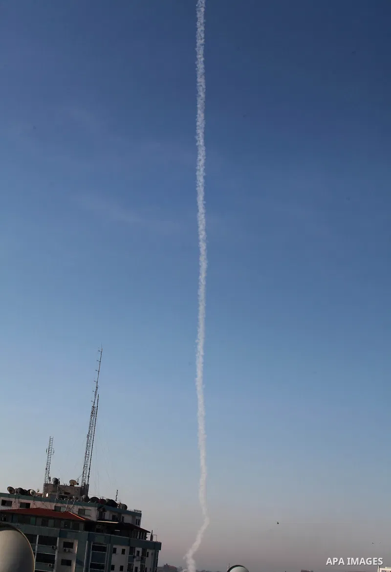 Rockets launched by Palestinian militants towards Israel make their way from the Gaza city, Thursday, Nov. 15, 2012. Photo by Ashraf Amra