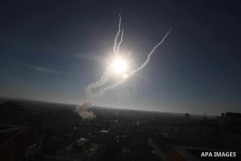Rockets launched by Palestinian militants towards Israel make their way from the Gaza city, Thursday, Nov. 15, 2012. Photo by Ashraf Amra