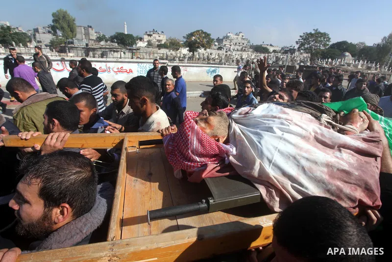 Palestinian mourners carry the body of Ahmad Jaabari, head of the military wing of the Hamas movement, the Ezzedin Qassam Brigades, during his funeral in Gaza City, on November 15, 2012. Tensions between Israel and Gaza...