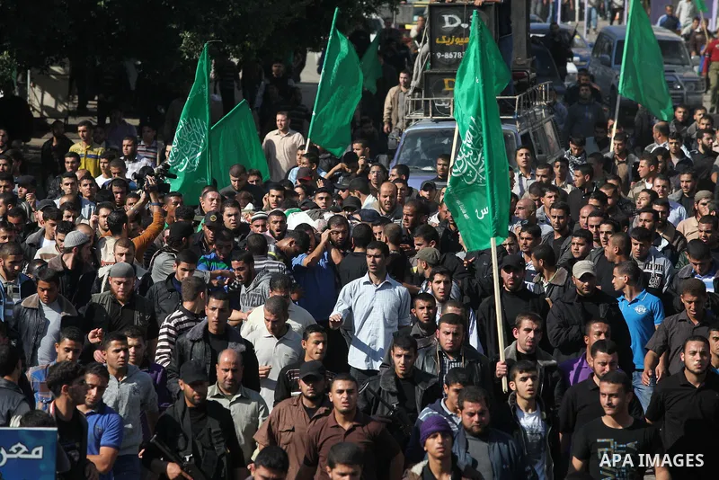 Palestinian mourners carry the body of Ahmad Jaabari, head of the military wing of the Hamas movement, the Ezzedin Qassam Brigades, during his funeral in Gaza City, on November 15, 2012. Tensions between Israel and Gaza...
