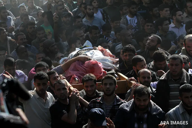 Palestinian mourners carry the body of Ahmad Jaabari, head of the military wing of the Hamas movement, the Ezzedin Qassam Brigades, during his funeral in Gaza City, on November 15, 2012. Tensions between Israel and Gaza...