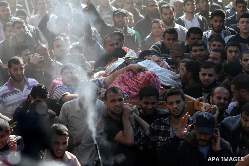 Palestinian mourners carry the body of Ahmad Jaabari, head of the military wing of the Hamas movement, the Ezzedin Qassam Brigades, during his funeral in Gaza City, on November 15, 2012. Tensions between Israel and Gaza...