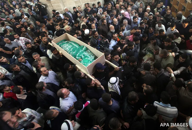 Palestinian mourners carry the body of girl of during her funeral in Gaza City, on November 15, 2012. Tensions between Israel and Gaza have sparked a furious response from Egypt's Islamist administration, which has close...