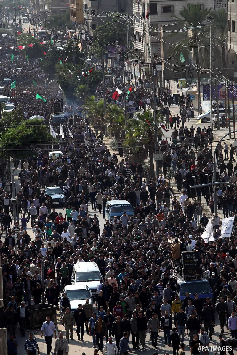 Palestinian mourners carry the body of Ahmad Jaabari, head of the military wing of the Hamas movement, the Ezzedin Qassam Brigades, during his funeral in Gaza City, on November 15, 2012. Tensions between Israel and Gaza...