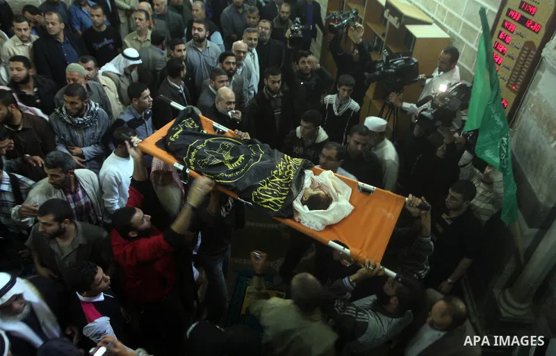 Palestinian mourners carry the body of girl of during her funeral in Gaza City, on November 15, 2012. Tensions between Israel and Gaza have sparked a furious response from Egypt's Islamist administration, which has close...