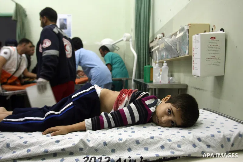 Palestinian medics treat a wounded boy at a hospital after an Israeli air strike in Khan Younis in the southern Gaza Strip November 15, 2012. Hamas fired dozens of rockets into southern Israel on Thursday, killing three...