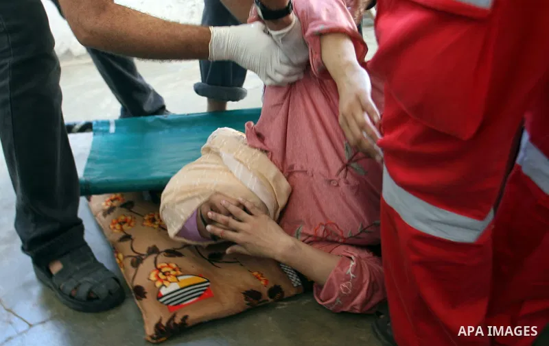 Palestinian medics treat a wounded woman at a hospital after an Israeli air strike in Khan Younis in the southern Gaza Strip November 15, 2012. Hamas fired dozens of rockets into southern Israel on Thursday, killing thre...
