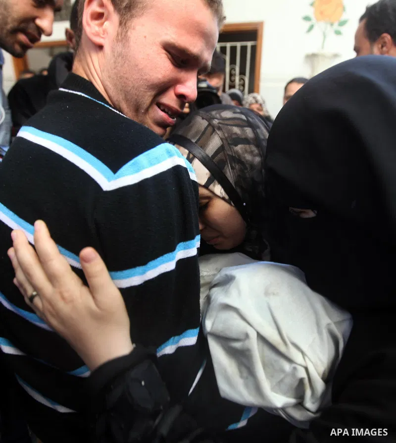 The parents of 11-month-old baby boy Omar al-Masharawi during his funeral in Gaza City, on November 15, 2012. Tensions between Israel and Gaza have sparked a furious response from Egypt's Islamist administration, which h...