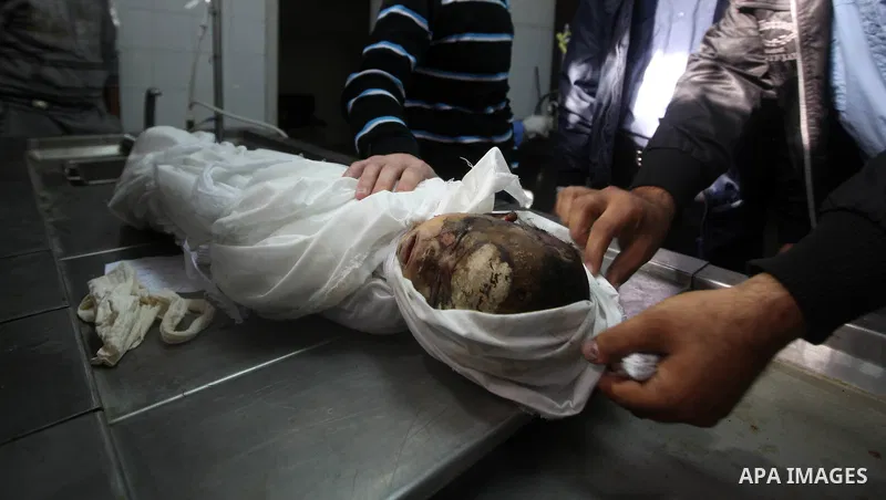 The parents of 11-month-old baby boy Omar al-Masharawi during his funeral in Gaza City, on November 15, 2012. Tensions between Israel and Gaza have sparked a furious response from Egypt's Islamist administration, which h...