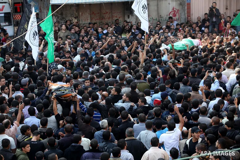 Palestinian mourners carry the body of Ahmad Jaabari, head of the military wing of the Hamas movement, the Ezzedin Qassam Brigades, during his funeral in Gaza City, on November 15, 2012. Tensions between Israel and Gaza...